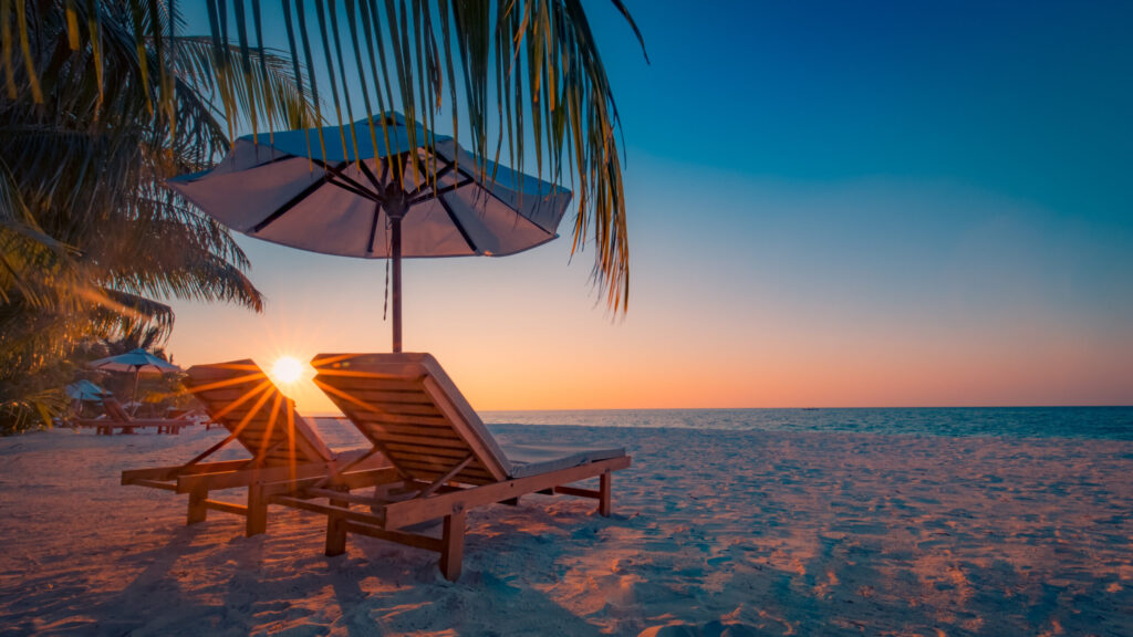 lounge chairs on the beach scaled